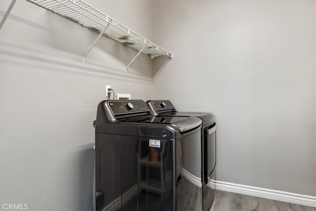 420 Deodar St, Redlands, CA 92374 - washroom with washing machine and dryer and wood finished floors