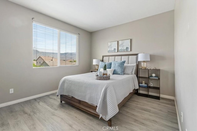 420 Deodar St, Redlands, CA 92374 - bedroom featuring baseboards and wood finished floors