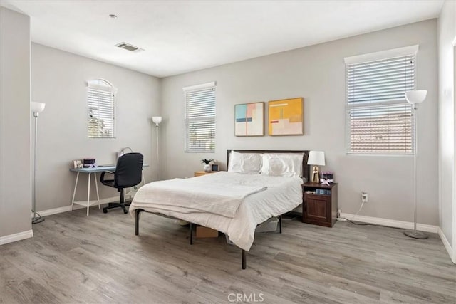 420 Deodar St, Redlands, CA 92374 - bedroom with light wood-style flooring and a desk