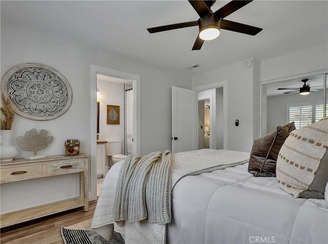 2867 Turnbull St, Oceanside, CA 92054 - bedroom with light wood-type flooring, a ceiling fan, connected bathroom, and a closet