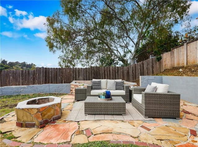 2867 Turnbull St, Oceanside, CA 92054 - fenced backyard featuring a patio and an outdoor living space with a fire pit