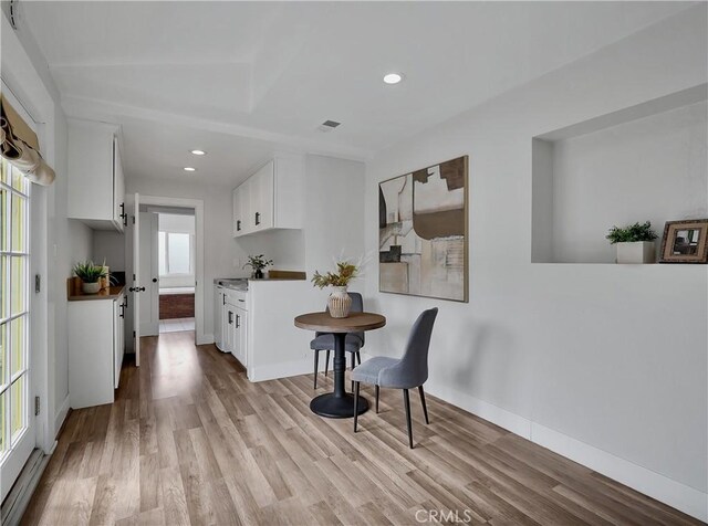 2867 Turnbull St, Oceanside, CA 92054 - kitchen with light wood-style floors, white cabinetry, and recessed lighting