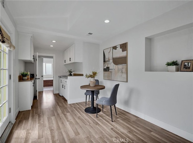 2867 Turnbull St, Oceanside, CA 92054 - kitchen with light wood-style floors, white cabinets, and recessed lighting