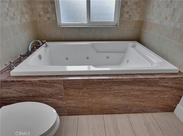 2867 Turnbull St, Oceanside, CA 92054 - bathroom with a jetted tub, tile walls, and wood finished floors