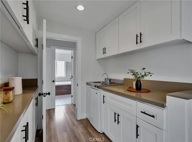 2867 Turnbull St, Oceanside, CA 92054 - kitchen featuring dark wood-style flooring, white cabinetry, and recessed lighting