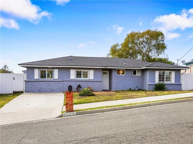 2867 Turnbull St, Oceanside, CA 92054 - ranch-style house with brick siding, stucco siding, and concrete driveway