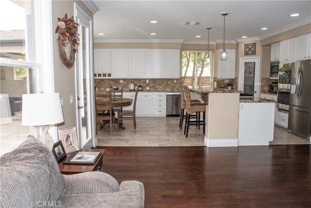1671 Fairway Dr, Corona, CA 92883 - living room featuring ornamental molding, recessed lighting, and light wood-style floors