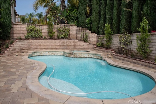 1671 Fairway Dr, Corona, CA 92883 - view of pool featuring a fenced backyard, a pool with connected hot tub, and a patio