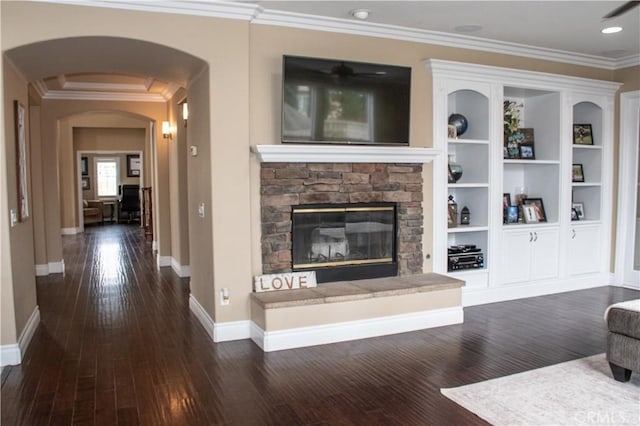 1671 Fairway Dr, Corona, CA 92883 - living area featuring a stone fireplace, ornamental molding, dark wood finished floors, arched walkways, and a ceiling fan