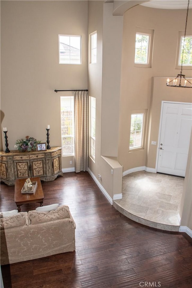 1671 Fairway Dr, Corona, CA 92883 - entryway with a towering ceiling, dark wood-style floors, and a chandelier