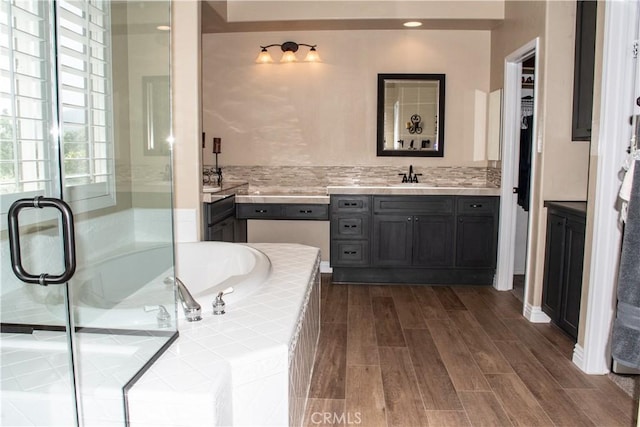 1671 Fairway Dr, Corona, CA 92883 - full bathroom with vanity, a garden tub, wood finished floors, and a stall shower