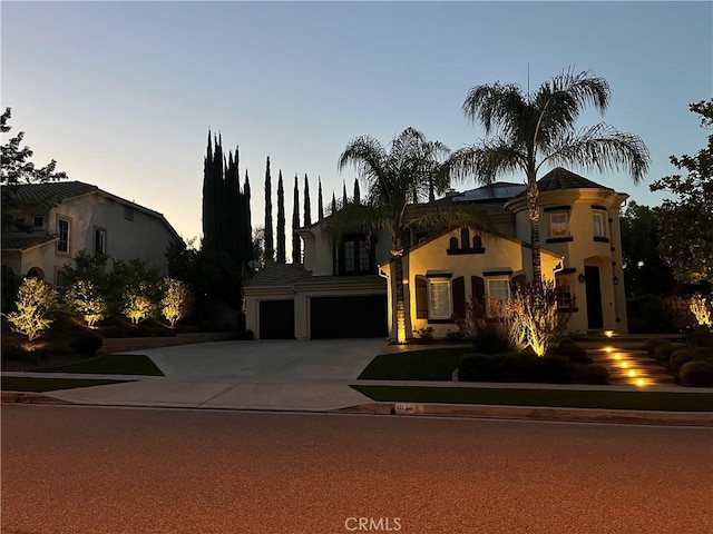 1671 Fairway Dr, Corona, CA 92883 - mediterranean / spanish house with stucco siding, concrete driveway, and a garage
