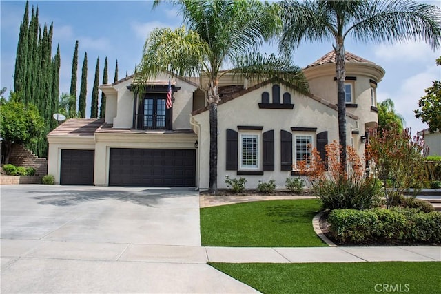 1671 Fairway Dr, Corona, CA 92883 - mediterranean / spanish-style house with french doors, stucco siding, a garage, concrete driveway, and a front yard