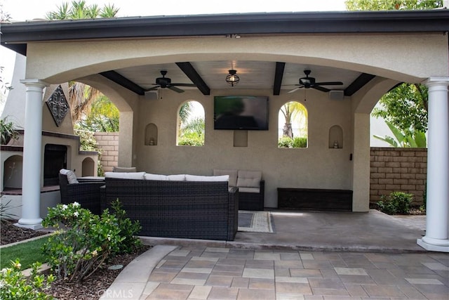 1671 Fairway Dr, Corona, CA 92883 - view of patio featuring ceiling fan and an outdoor living space with a fireplace