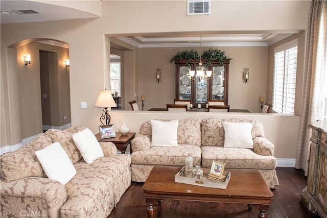 1671 Fairway Dr, Corona, CA 92883 - living area featuring arched walkways, dark wood finished floors, a chandelier, and crown molding