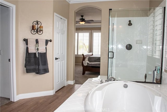 1671 Fairway Dr, Corona, CA 92883 - ensuite bathroom with a ceiling fan, a bath, a shower stall, and wood finished floors