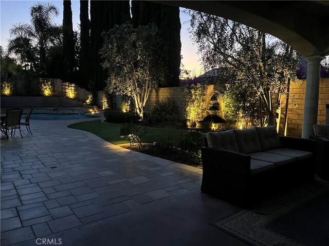 1671 Fairway Dr, Corona, CA 92883 - patio terrace at dusk with a patio, an outdoor living space, and a fenced backyard