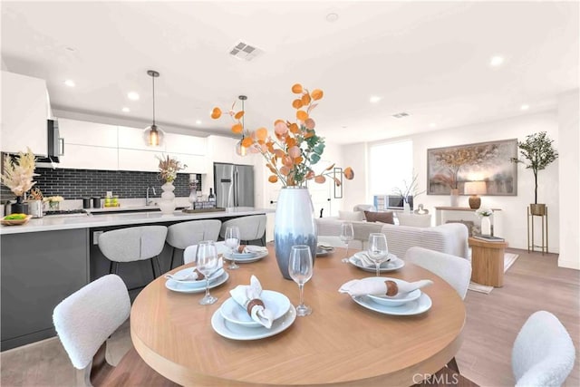 1131/2 N Manhattan Pl, Los Angeles, CA 90004 - dining room featuring recessed lighting and light wood-type flooring