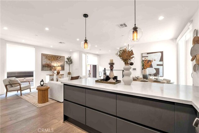 1131/2 N Manhattan Pl, Los Angeles, CA 90004 - kitchen featuring open floor plan, recessed lighting, light countertops, decorative light fixtures, and plenty of natural light