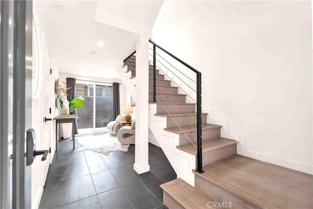 1131/2 N Manhattan Pl, Los Angeles, CA 90004 - entryway featuring stairs, dark tile patterned flooring, and recessed lighting