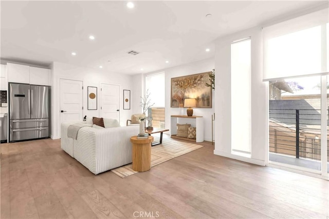 1131/2 N Manhattan Pl, Los Angeles, CA 90004 - living area with light wood-type flooring and recessed lighting