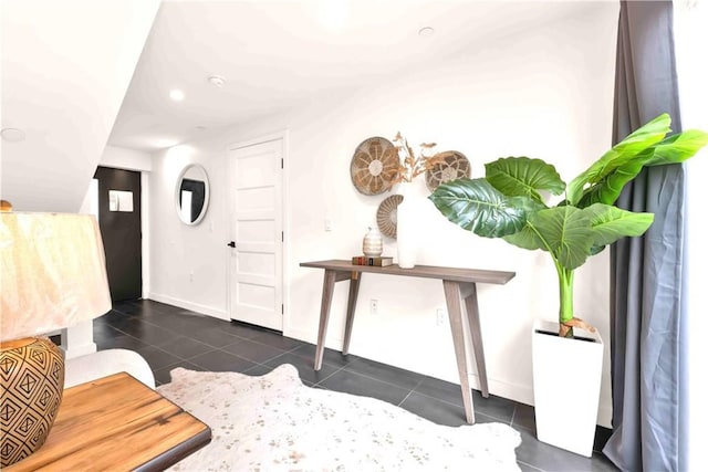 1131/2 N Manhattan Pl, Los Angeles, CA 90004 - foyer featuring dark tile patterned flooring and baseboards