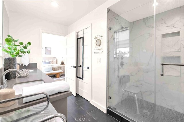1131/2 N Manhattan Pl, Los Angeles, CA 90004 - full bath with a marble finish shower, ensuite bathroom, tile patterned flooring, and vanity