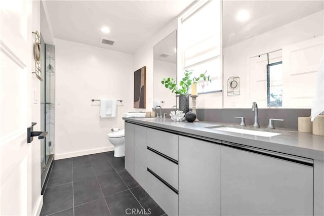 1131/2 N Manhattan Pl, Los Angeles, CA 90004 - full bathroom featuring double vanity, tile patterned floors, a stall shower, and recessed lighting