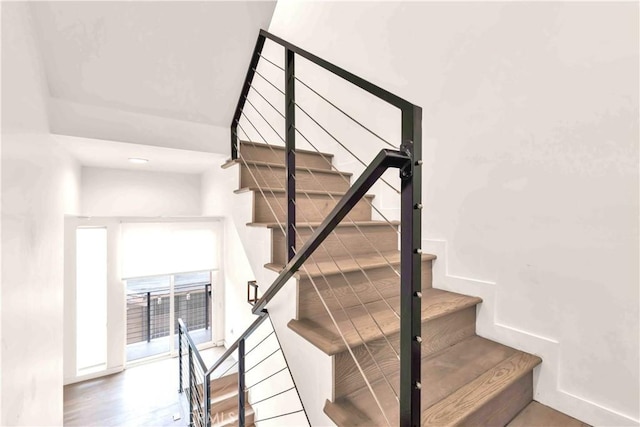 1131/2 N Manhattan Pl, Los Angeles, CA 90004 - staircase featuring baseboards