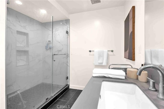 1131/2 N Manhattan Pl, Los Angeles, CA 90004 - bathroom with a marble finish shower, tile patterned floors, double vanity, and recessed lighting