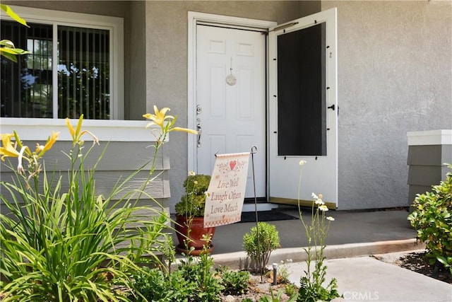 8 Chatri Cir, Lake Forest, CA 92610 - entrance to property featuring stucco siding