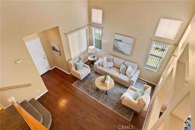 8 Chatri Cir, Lake Forest, CA 92610 - living room with a towering ceiling, healthy amount of natural light, and wood finished floors