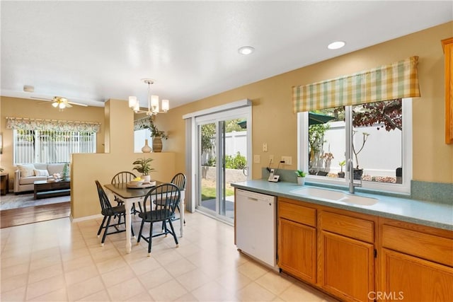 8 Chatri Cir, Lake Forest, CA 92610 - kitchen featuring dishwasher, a chandelier, brown cabinetry, decorative light fixtures, and light countertops