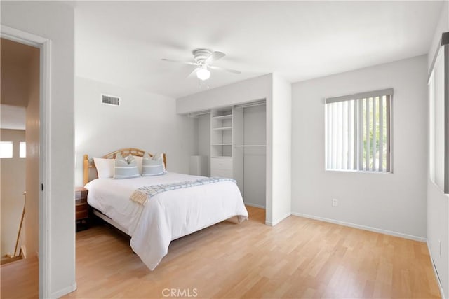 8 Chatri Cir, Lake Forest, CA 92610 - bedroom with light wood-type flooring, multiple windows, and a ceiling fan