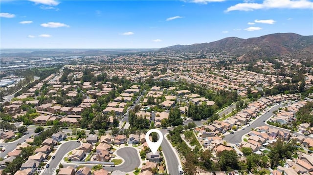 8 Chatri Cir, Lake Forest, CA 92610 - aerial view of property and surrounding area featuring a mountain backdrop and nearby suburban area
