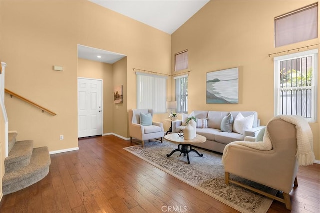8 Chatri Cir, Lake Forest, CA 92610 - living room featuring high vaulted ceiling, hardwood / wood-style flooring, and stairs