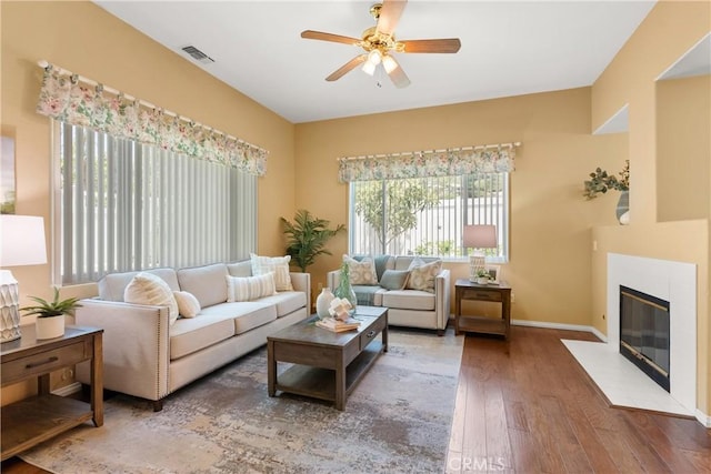 8 Chatri Cir, Lake Forest, CA 92610 - living area featuring wood finished floors, a ceiling fan, and a fireplace
