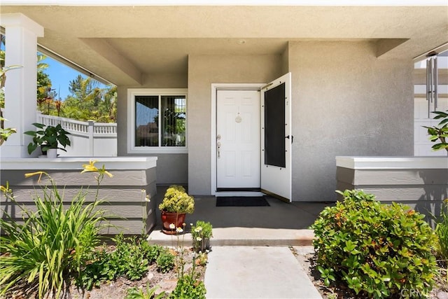 8 Chatri Cir, Lake Forest, CA 92610 - view of exterior entry with stucco siding
