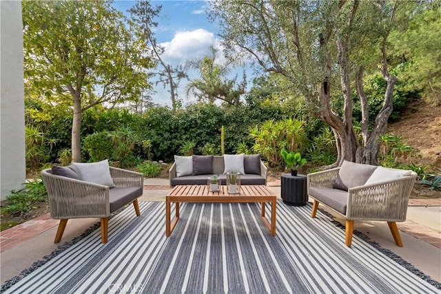 9767 Blantyre Dr, Beverly Hills, CA 90210 - view of patio with an outdoor living space and view of wooded area