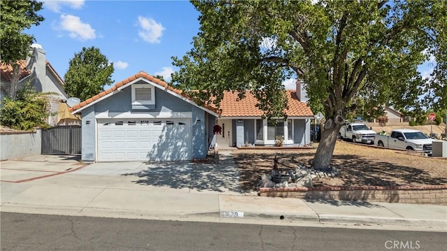 529 Hilltop, Palmdale, CA 93551 - ranch-style home with a garage, a tiled roof, stucco siding, and driveway
