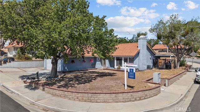 529 Hilltop, Palmdale, CA 93551 - view of front of home featuring driveway, a chimney, a tile roof, and stucco siding