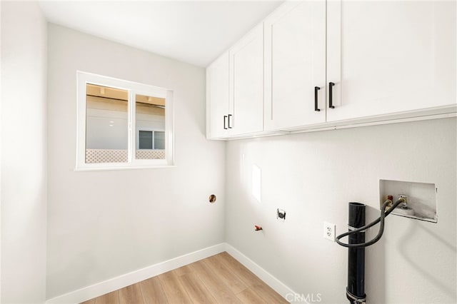 28610 Portsmouth Dr, Menifee, CA 92586 - laundry area with cabinet space, gas dryer hookup, washer hookup, and light wood-style flooring