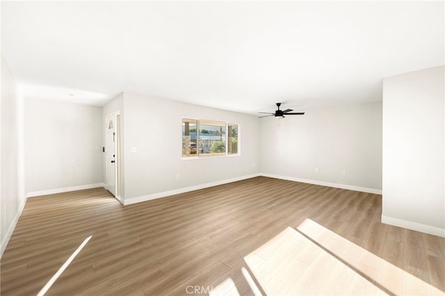 28610 Portsmouth Dr, Menifee, CA 92586 - unfurnished living room featuring wood finished floors and a ceiling fan