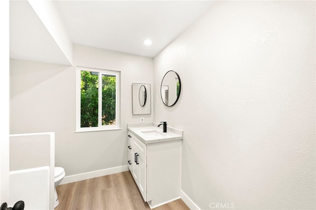 28610 Portsmouth Dr, Menifee, CA 92586 - bathroom with vanity, wood finished floors, and recessed lighting