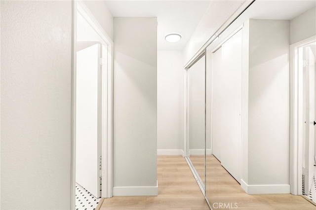 28610 Portsmouth Dr, Menifee, CA 92586 - hallway featuring baseboards and light wood-style floors
