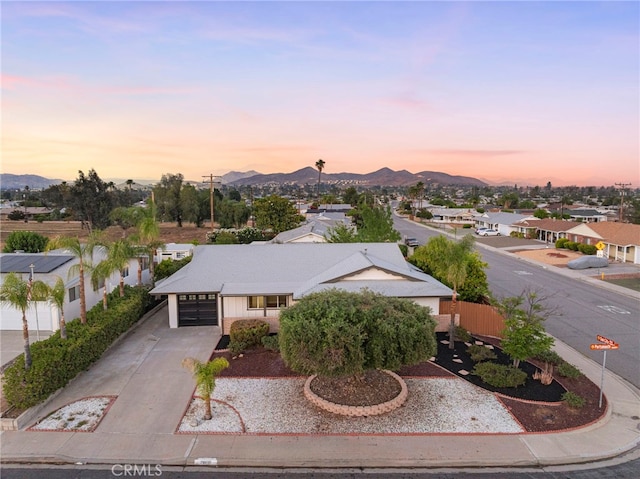 28610 Portsmouth Dr, Menifee, CA 92586 - view of front of property with concrete driveway, a mountain view, an attached garage, and a residential view