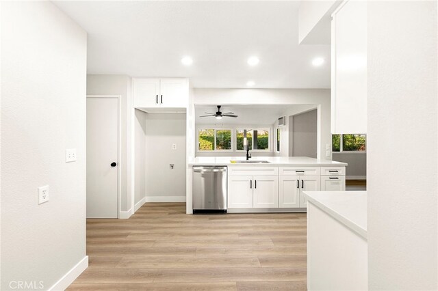 28610 Portsmouth Dr, Menifee, CA 92586 - kitchen with stainless steel dishwasher, white cabinetry, a ceiling fan, light wood-style flooring, and recessed lighting