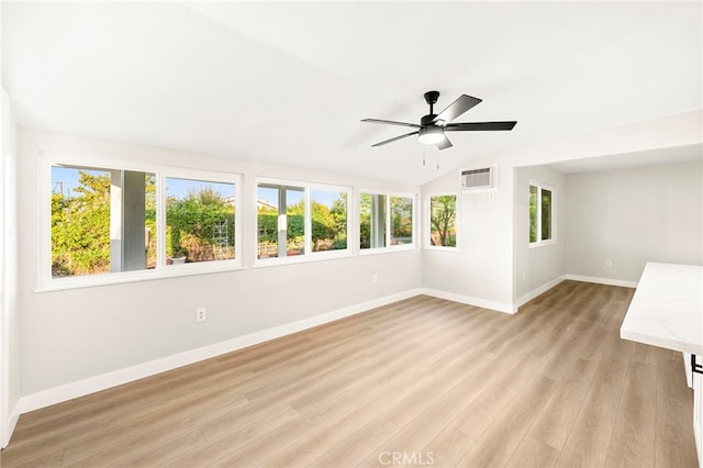 28610 Portsmouth Dr, Menifee, CA 92586 - unfurnished room featuring lofted ceiling, ceiling fan, light wood-type flooring, and a wall mounted air conditioner