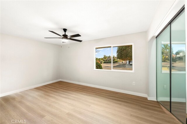 28610 Portsmouth Dr, Menifee, CA 92586 - unfurnished bedroom with a closet, light wood-style flooring, and a ceiling fan
