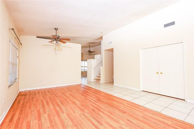 19385 Live Oak Ln, Lake Elsinore, CA 92530 - unfurnished living room featuring a ceiling fan, stairway, and wood finished floors